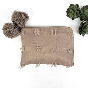 Deux Lux clutch with decorative poms